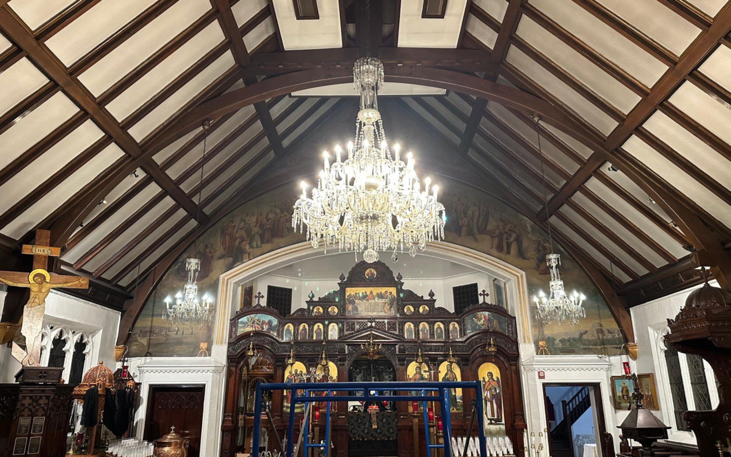 Ornate church interior with chandeliers and religious icons